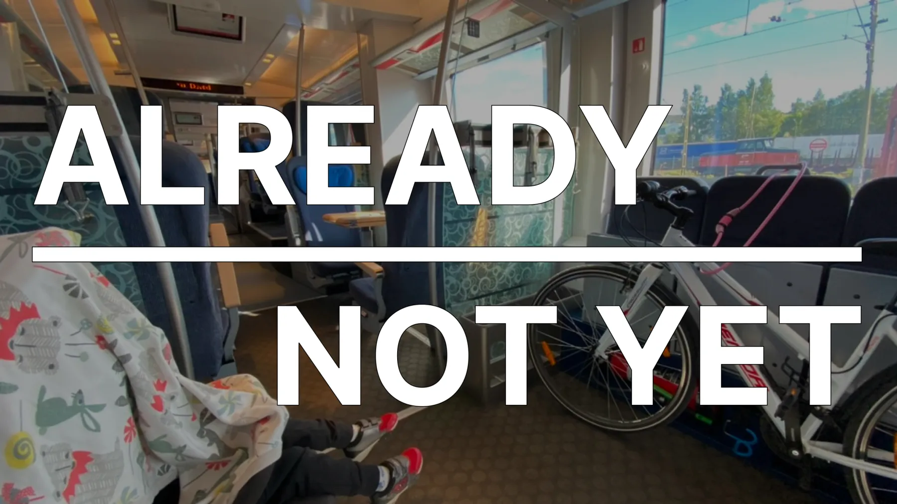 A train car with two contrasting compartments, creating a clear division between passengers. On top, there are two texts: “Already” and “Not Yet”.